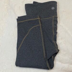 Athleta Salutation Stash High Rise Leggings in a grey heathered color